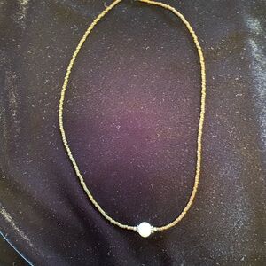 Choker necklace- small brown beads with center Pearl-like bead.